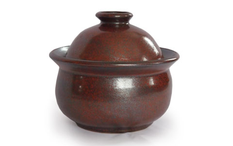 photo of small brown lidded jar